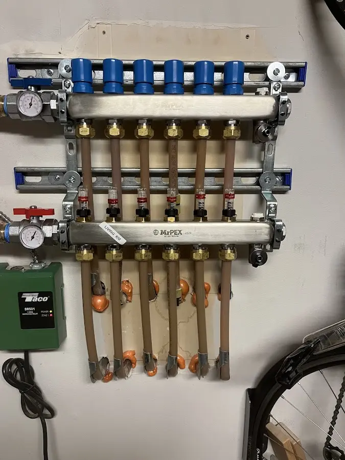 Plumber performing Water Heater Repair at a residential property in Tea